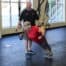 Brett Smith spotting a client on the TRX during a personal training session.