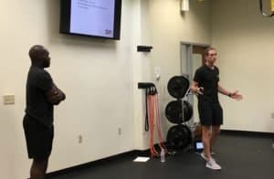 Personal trainers Ryan Burke and Gb instructing clients in nutrition and weight loss.