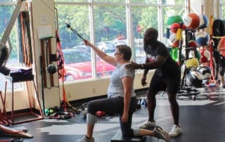 Personal trainer Gbolahan Olaogun conducting a personal training session.