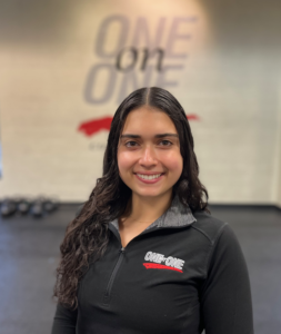 Julia Trainer Smiling in her professional headshot as a personal trainer at One on One Fitness State College. PA