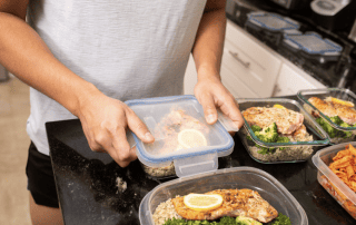 Healthy meal prep in glass containers for personalized fitness and weight loss programs.