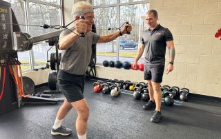 Working out with encouragement for personal training and fitness success.