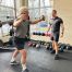 Working out with encouragement for personal training and fitness success.