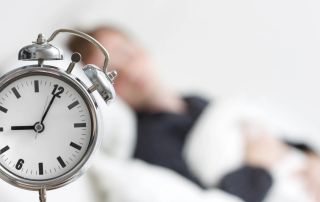 Alarm clock emphasizing personalized fitness coaching and scheduling.