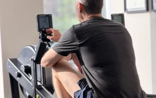 Client working out on rower machine